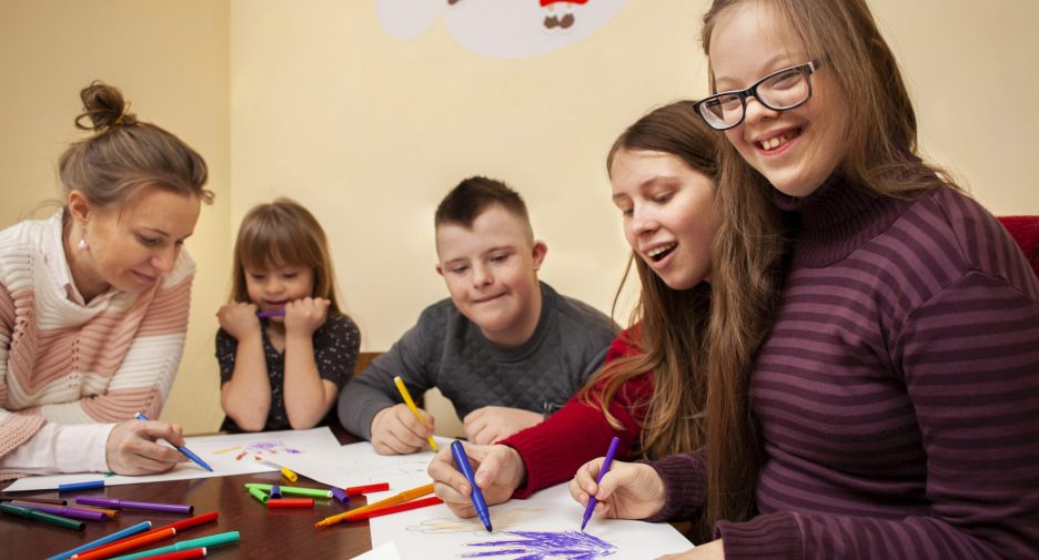 happy-girl-with-down-syndrome-posing-while-drawing-2048x1463